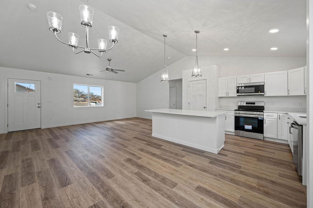 166 Orchard View Way Grand Junction, CO 81503 - Photo 5 of 20 a view of a kitchen with microwave and stove