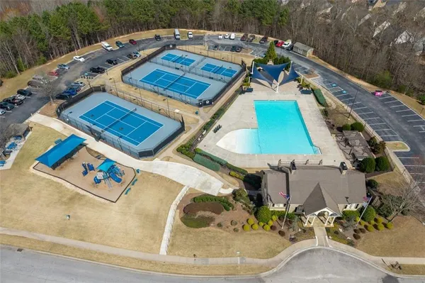 an aerial view of a house with a swimming pool