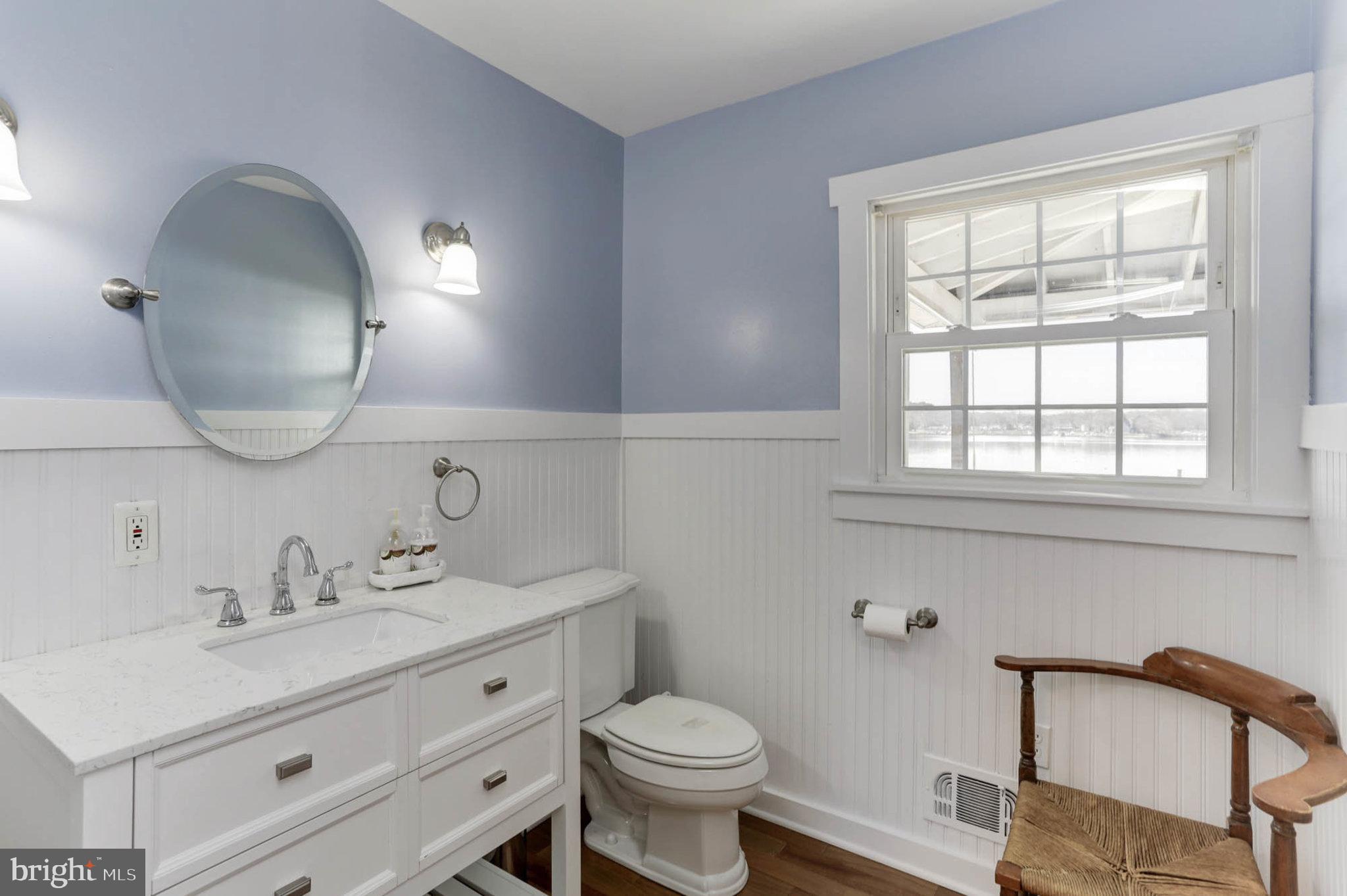 2103 Poplar Ridge Road Pasadena, MD 21122 - Photo 21 of 38 Half Bath w/ hardwood floors & Wainscotting