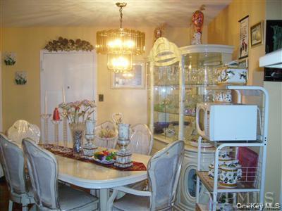 658 East 216th Street, Unit 3 Bronx, NY 10467 - Photo 9 of 10 Dining space featuring a chandelier