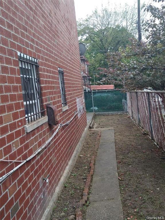 658 East 216th Street, Unit 3 Bronx, NY 10467 - Photo 10 of 10 View of home's exterior with brick siding