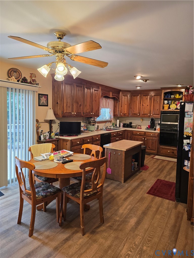 701 Whitestone Place Colonial Heights, VA 23834 - Photo 11 of 25 a kitchen with a table chairs stainless steel appliances and cabinets