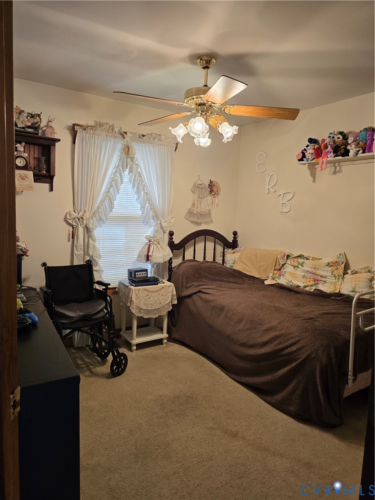 701 Whitestone Place Colonial Heights, VA 23834 - Photo 15 of 25 a bedroom with a bed and a chandelier