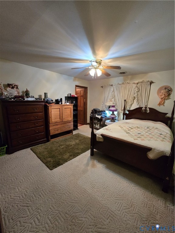 701 Whitestone Place Colonial Heights, VA 23834 - Photo 16 of 25 a bedroom with a bed and a chandelier