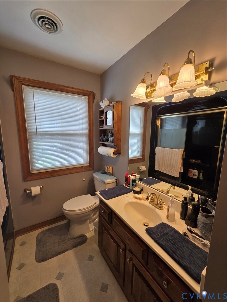 701 Whitestone Place Colonial Heights, VA 23834 - Photo 18 of 25 a bathroom with a sink and a mirror