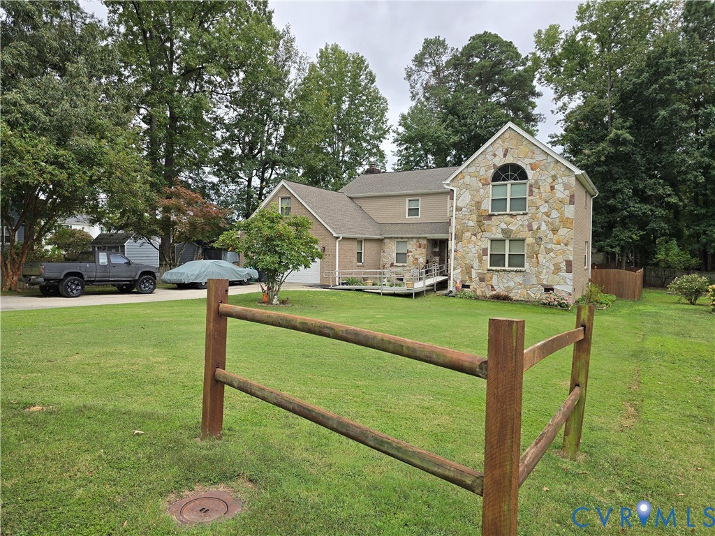 701 Whitestone Place Colonial Heights, VA 23834 - Photo 2 of 25 a front view of a house with garden