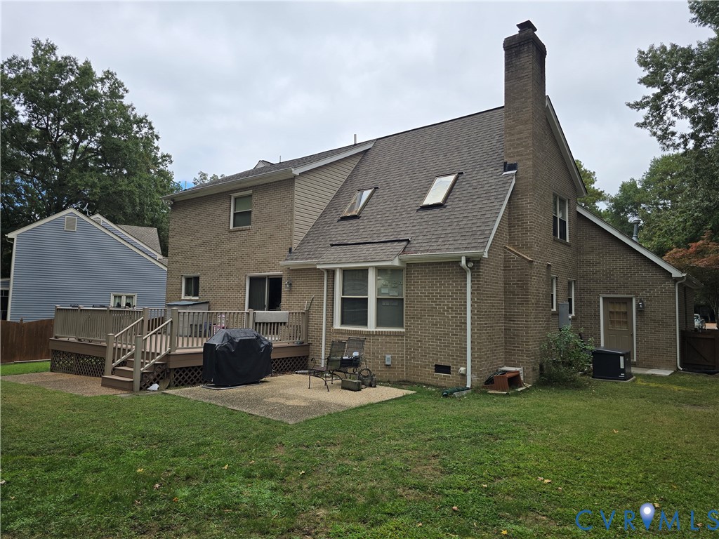 701 Whitestone Place Colonial Heights, VA 23834 - Photo 3 of 25 a front view of a house with a garden and plants