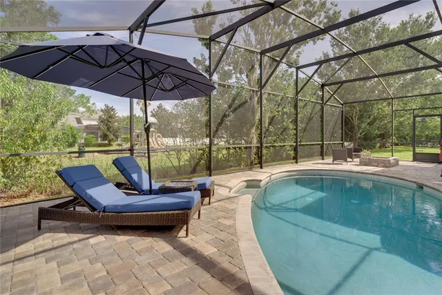 a view of a swimming pool with a patio