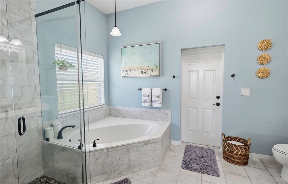 1771 Mistletoe Street Sebastian, FL 32958 - Photo 19 of 36 a bathroom with a tub and a shower