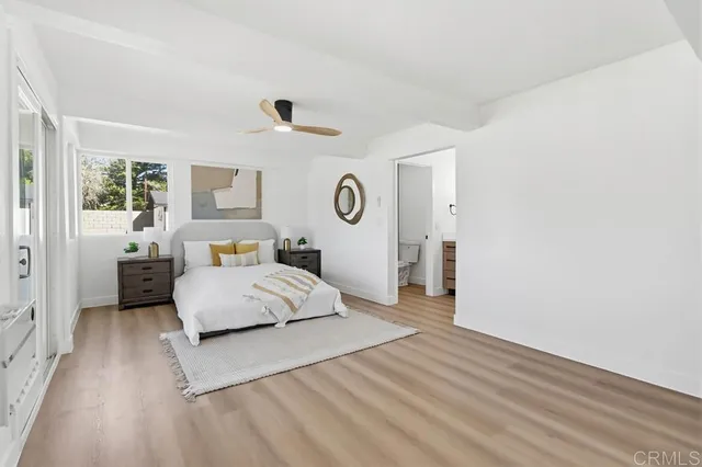 a spacious bedroom with a bed and a couch