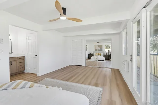 a view of a bedroom with bed and hallway