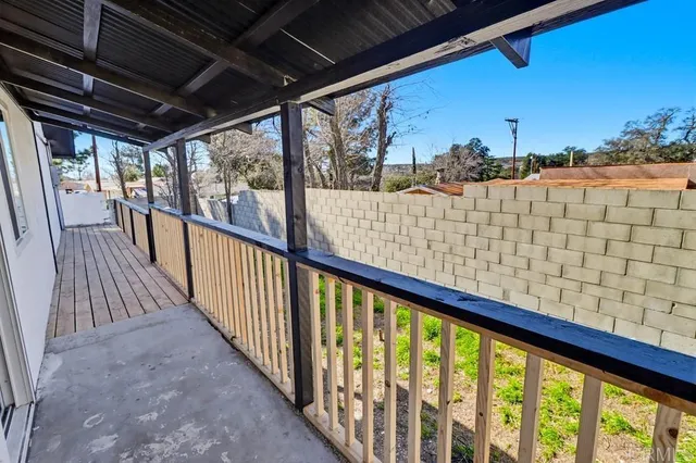 a view of balcony with furniture