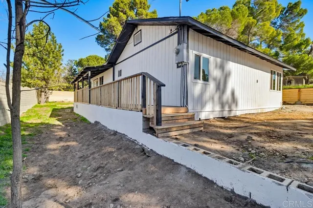 a view of a balcony with wooden floor
