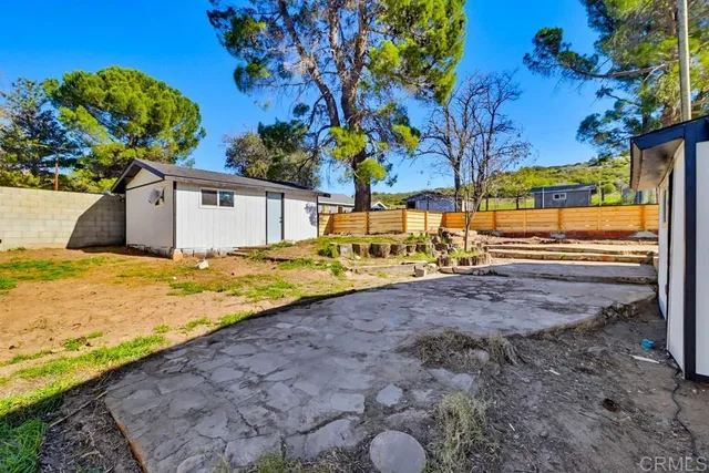 a house with trees in the background