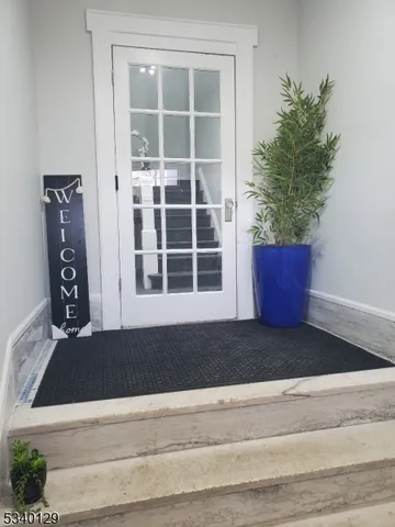 a view of a door and a window