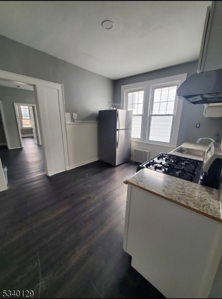 127 Sunset Avenue, Unit 1 Newark, NJ 07106 - Photo 3 of 12 a living room with hard wood floors and a fireplace