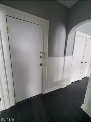 an empty room with wooden floor