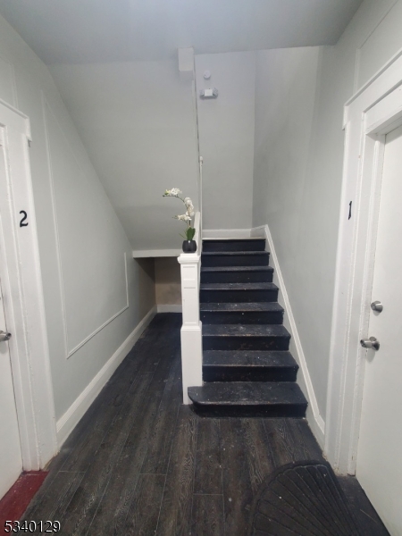 127 Sunset Avenue, Unit 1 Newark, NJ 07106 - Photo 9 of 12 a view of entryway and hall with wooden floor