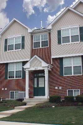 255 South Oak Creek Lane Romeoville, IL 60446 - Photo 7 of 7 a front view of a house with a yard