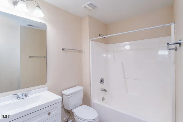 a bathroom with a sink toilet a shower and a mirror