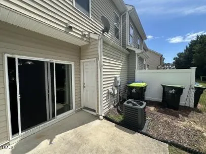 a front view of a house with chairs