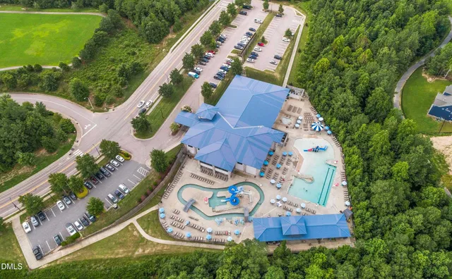 a view of a patio with table and chairs