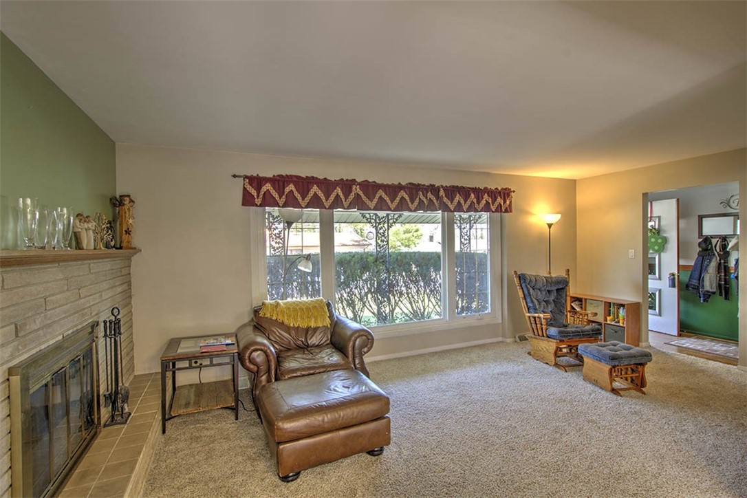 120 Point Bluff Drive Decatur, IL 62521 - Photo 5 of 34 a living room with furniture and a fireplace