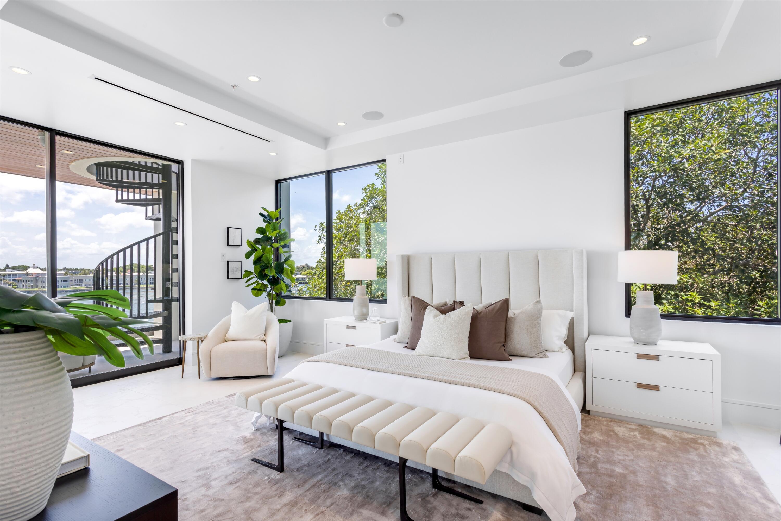 900 Lago Mar Lane, Unit PH Boca Raton, FL 33431 - Photo 20 of 58 a bedroom with furniture and a large window