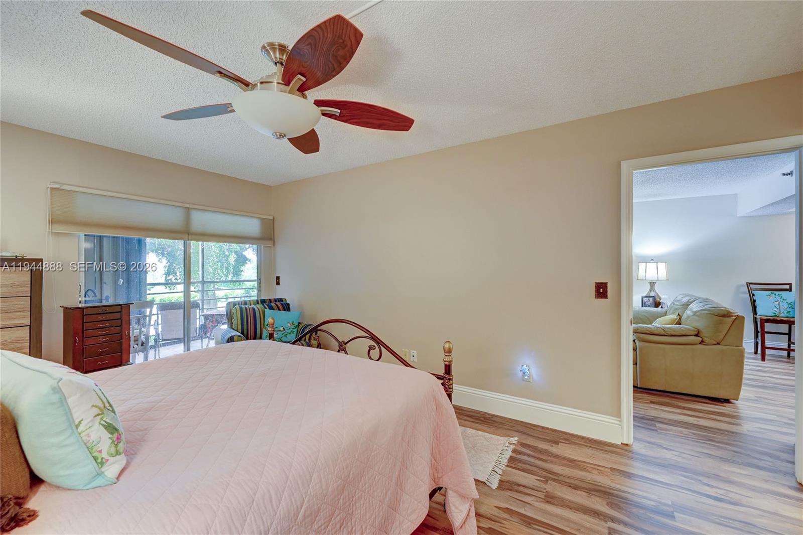 23344 Carolwood Lane, Unit 303 Boca Raton, FL 33428 - Photo 13 of 26 a bedroom with a bed and window