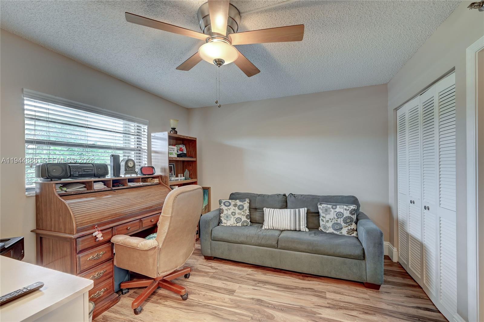 23344 Carolwood Lane, Unit 303 Boca Raton, FL 33428 - Photo 5 of 26 a living room with furniture and a window