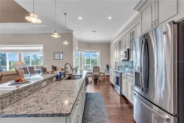 a large kitchen with stainless steel appliances