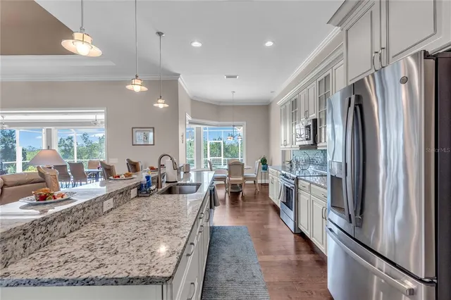 a large kitchen with stainless steel appliances