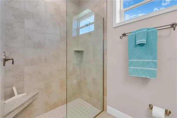 a bathroom with a shower and toilet