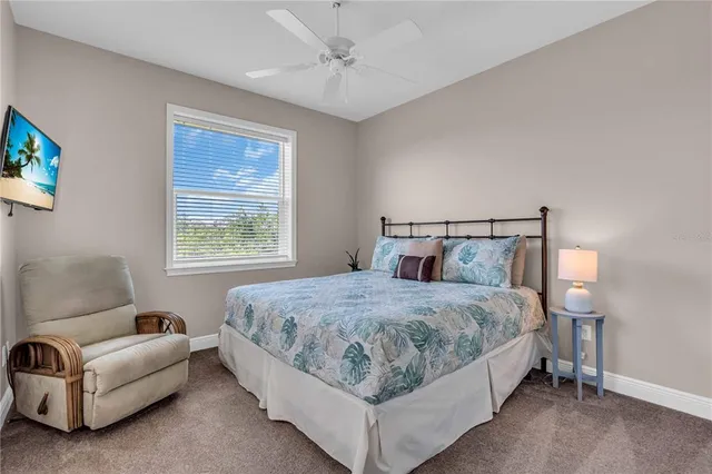 a bedroom with a bed couch and window