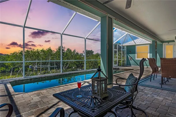 a view of a chairs and table in the balcony