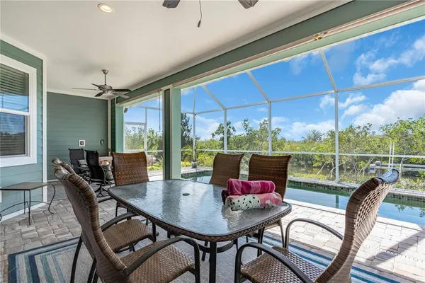 a view of a dining room with furniture window and outside view