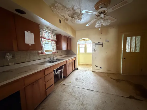 a large bathroom with a sink a large mirror and vanity
