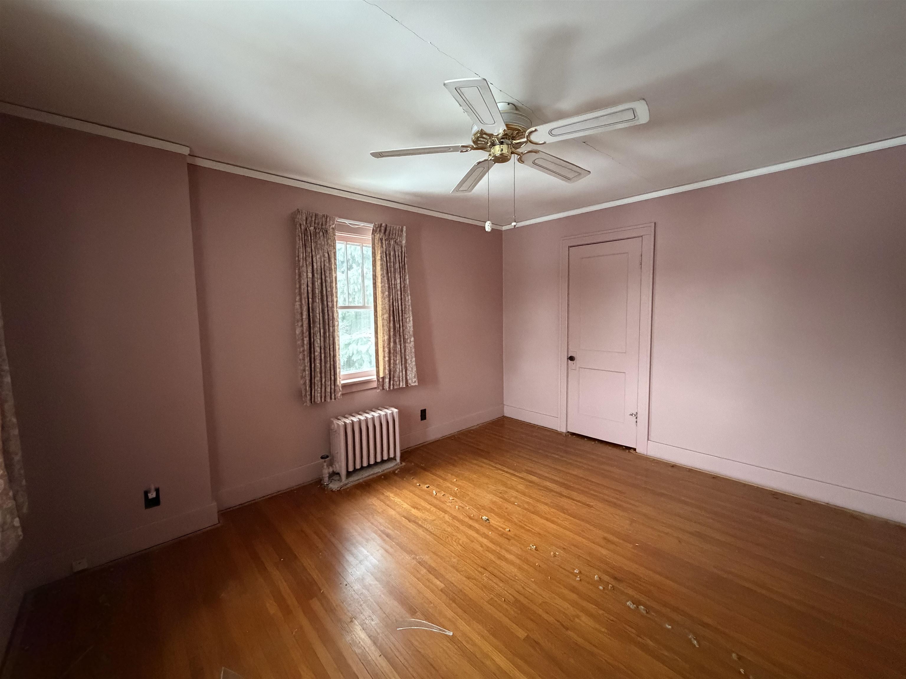 826 West Chestnut Street Freeport, IL 61032 - Photo 16 of 30 a view of an empty room with wooden floor and a window