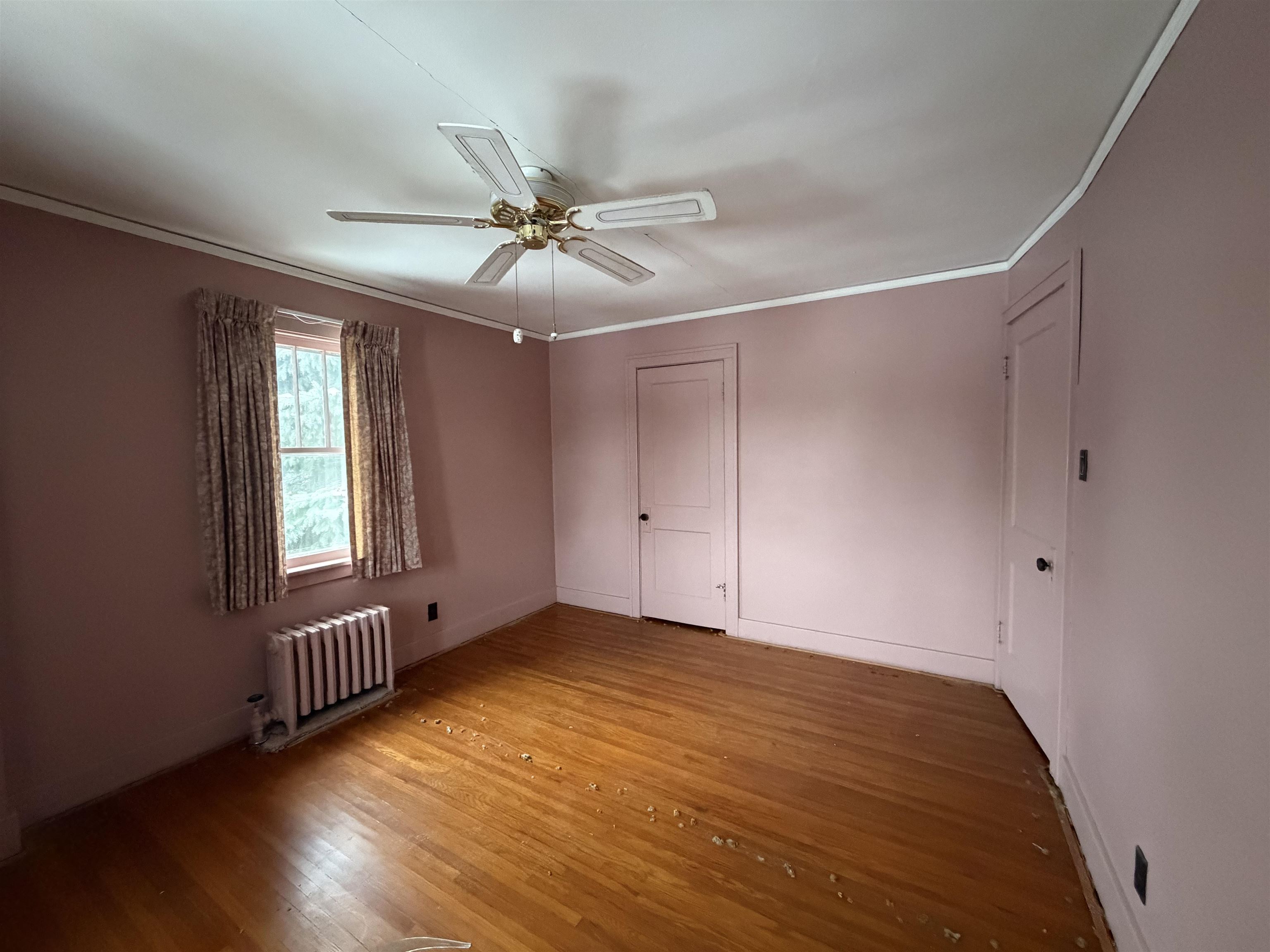 826 West Chestnut Street Freeport, IL 61032 - Photo 17 of 30 a view of an empty room with a window and wooden floor