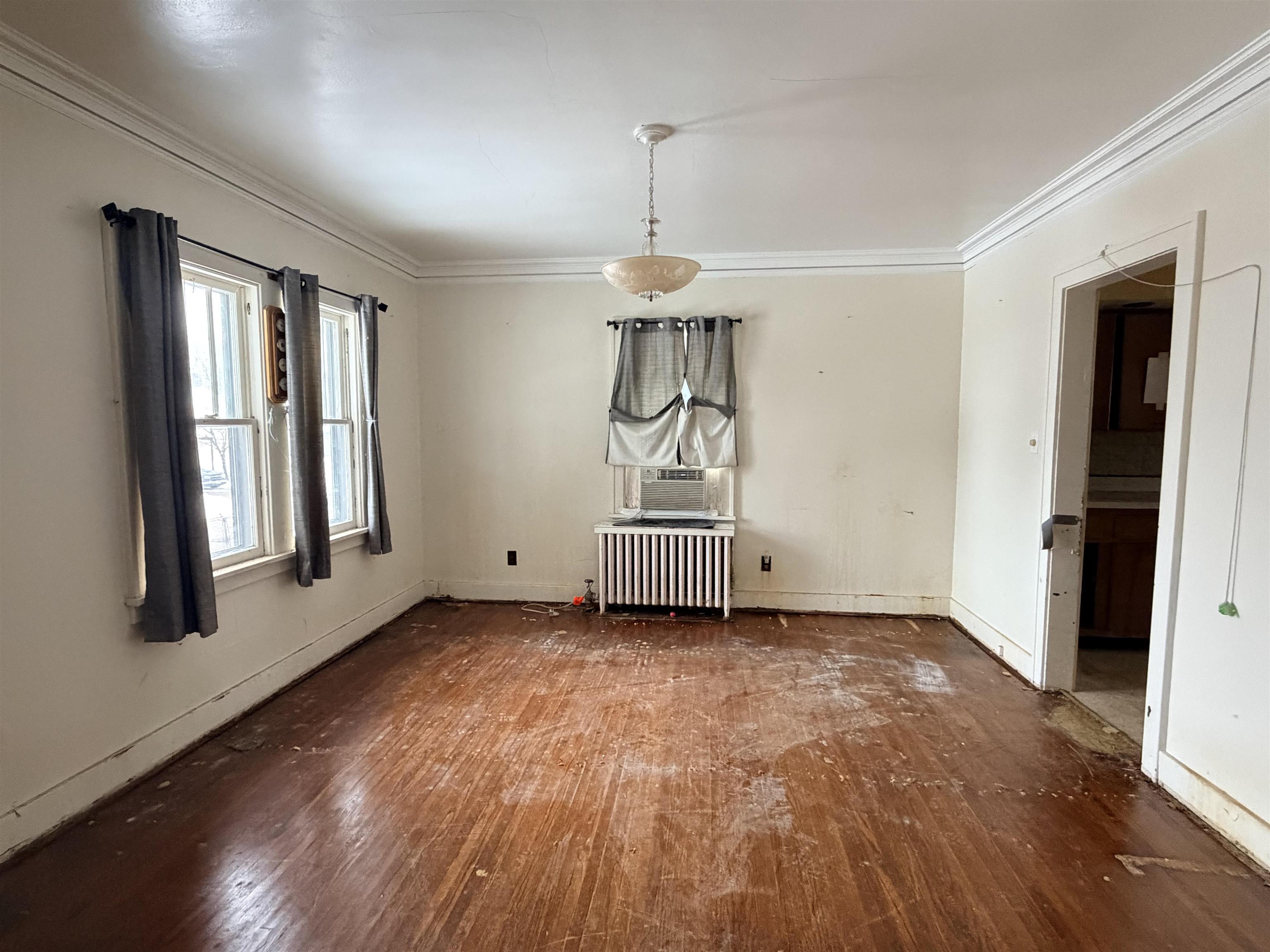 826 West Chestnut Street Freeport, IL 61032 - Photo 8 of 30 a view of empty room with wooden floor and fan