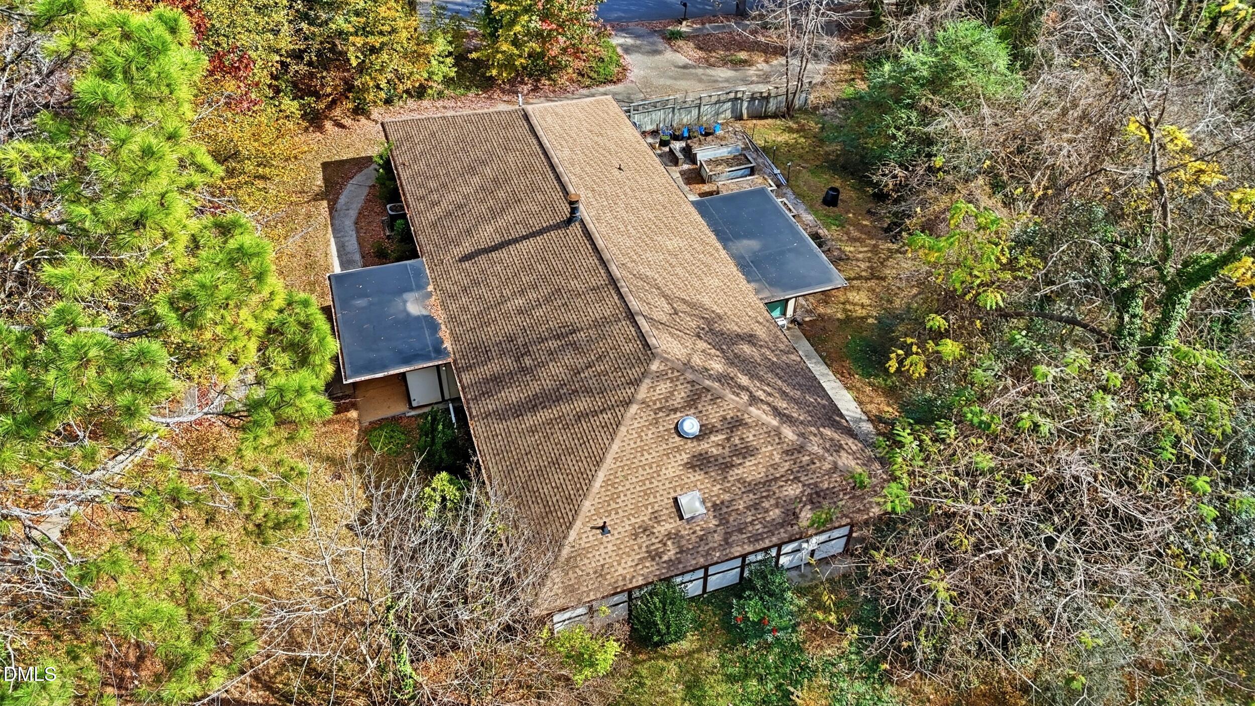 5301 Thayer Drive Raleigh, NC 27612 - Photo 5 of 7 an aerial view of a house with a yard