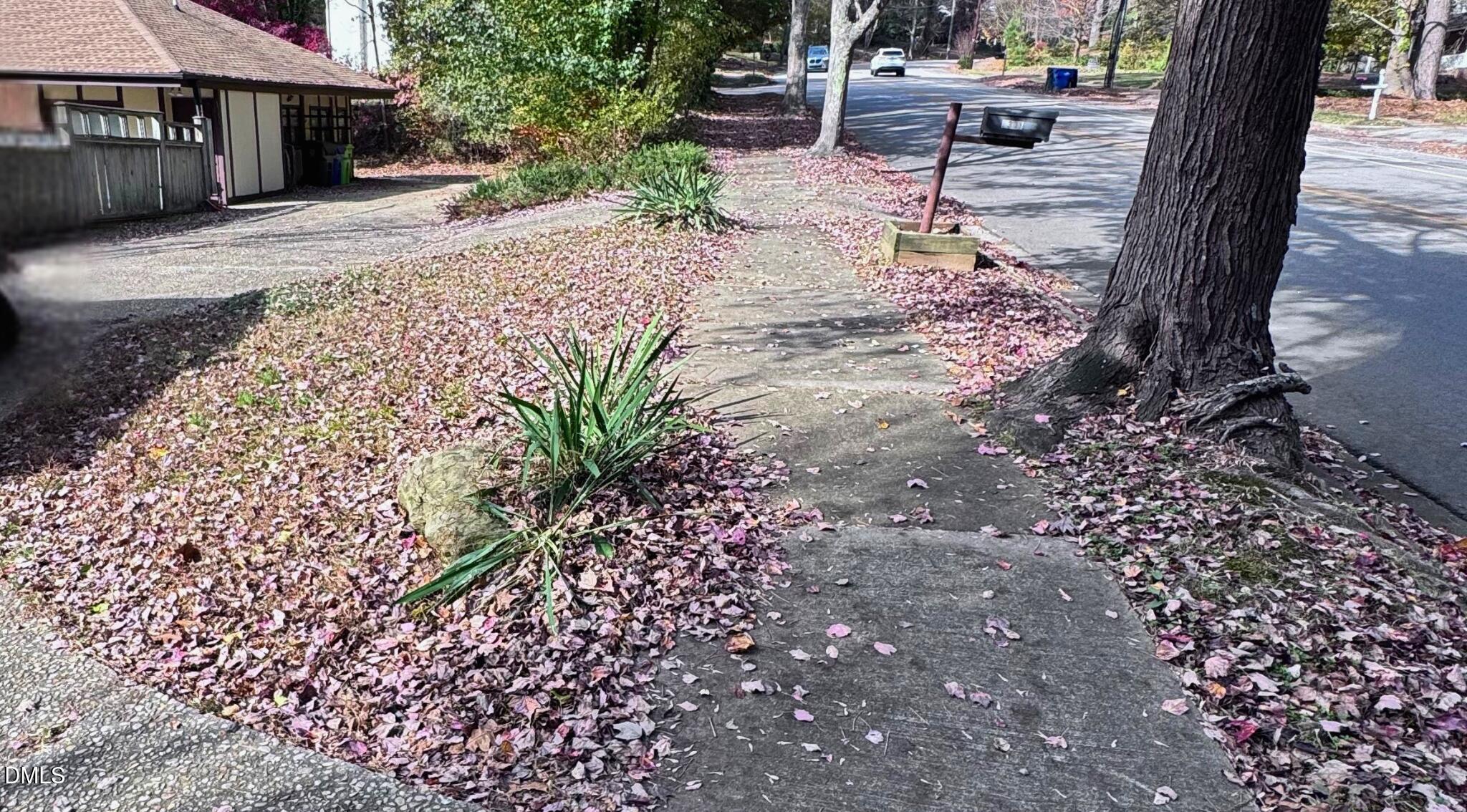 5301 Thayer Drive Raleigh, NC 27612 - Photo 7 of 7 a view of a backyard with a table and chairs under an umbrella