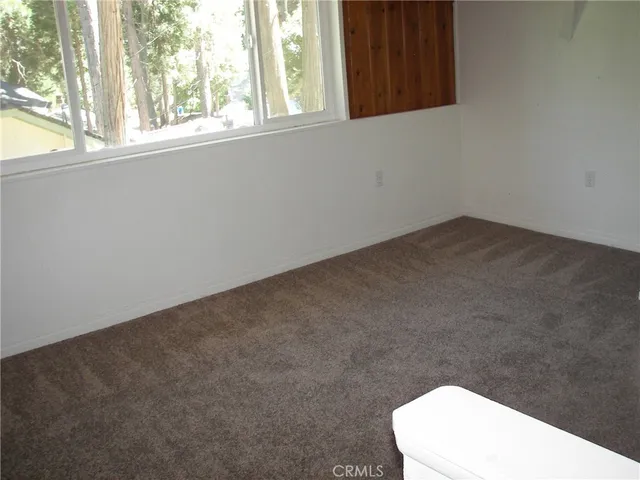 a bathroom with a sink a toilet and a window