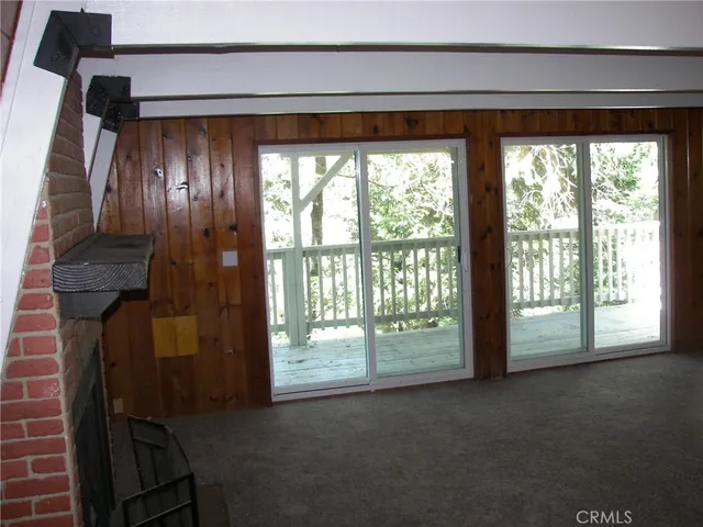 a view of empty room with floor to ceiling window
