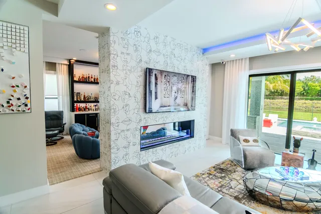 a view of a living room with a fireplace and a potted plant