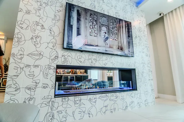 a living room with furniture and a flat screen tv