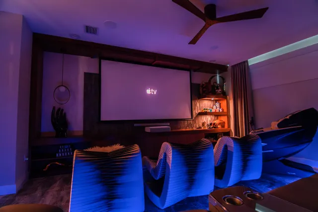 a bedroom with furniture and wooden floor