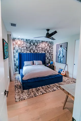 a view of walk in closet with clothes