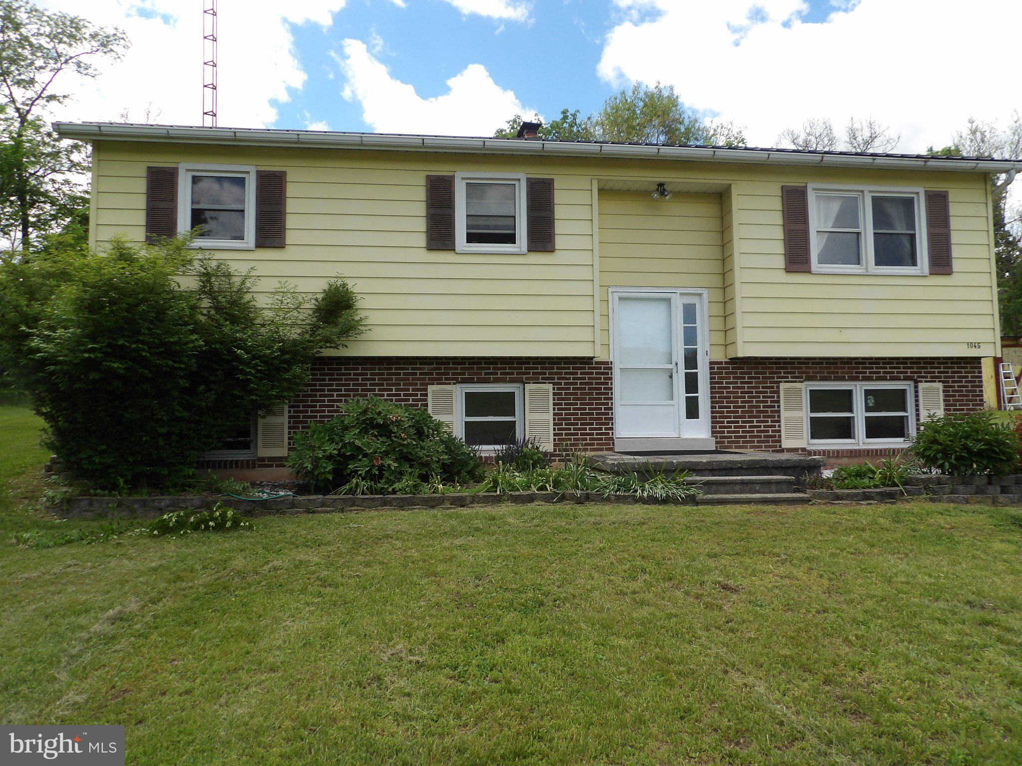 1045 Lockport Road Lewistown, PA 17044 - Photo 2 of 51 Charming split-level home with greenery.