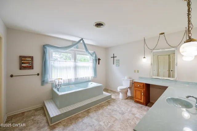 a view of a living room and dining room